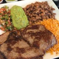 Carnitas · Served with rice, pinto beans, salsa, guacamole, and tortillas.