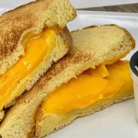 Grilled Cheese GF · American cheese melted to perfection on crispy gluten free bread.