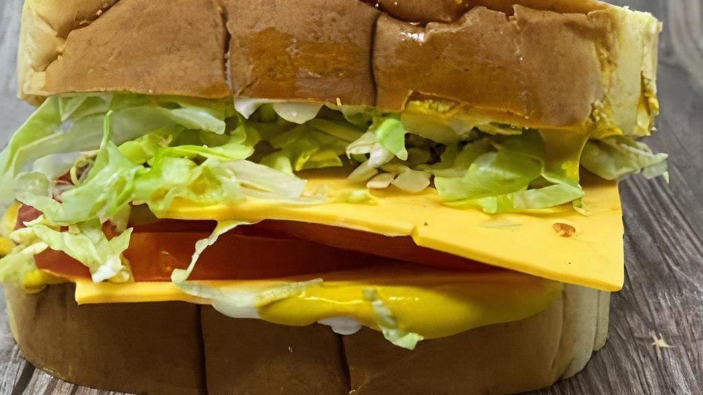 The American · American cheese, lettuce, tomato, mayo, & mustard on a fluffy white bun.