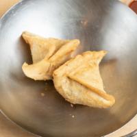 Samosa (2) · Veggie turnover, stuffed with potatoes, green peas, herbs, and spices, served with chutney