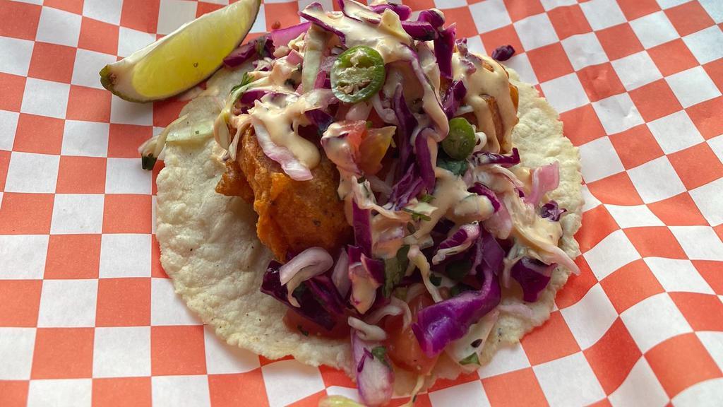 Valencia fish tacos(two tacos) · . Fried Mahi-Mahi
. Hand-made  Tortillas
. Achiote powder
. Pickle sauce, cabbage, onions, serrano peppers, tomatoes and cilantro