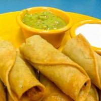 Taquitos Platter · Tasty chicken meat, wrapped up in fried corn tortillas. Served with sour cream and guacamole...