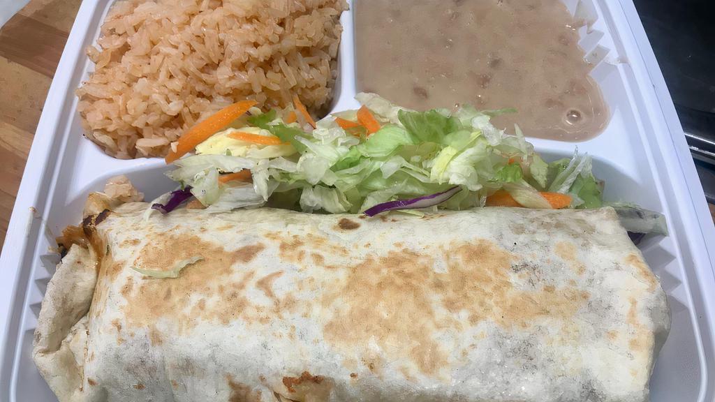 Burrito Especial · Your choice of meat with onions, cilantro, and hot sauce, wrapped up in a flour tortilla with rice and beans on the side.