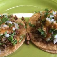 Taco Regular · Your choice of meat with onions, cilantro, and hot sauce in warm corn tortillas. (price is p...