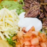 Taco Salad · Your choice of meat with beans, Monterey cheese,  lettuce, tomato, sour cream and guacamole ...