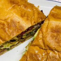 Torta · Your choice of meat with avocado, tomato, lettuce, sour cream, onions, cilantro and hot sauc...
