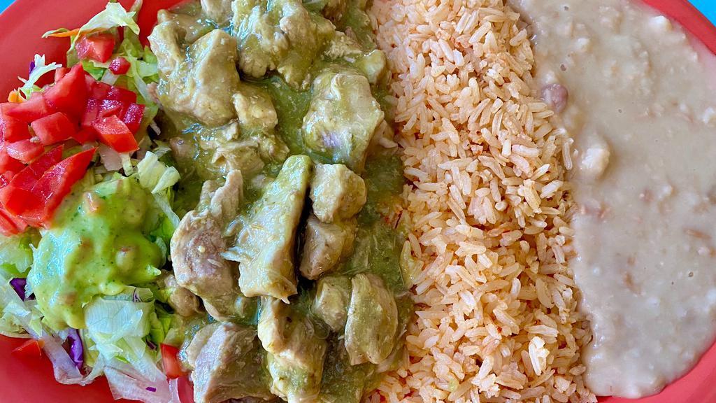 Chile Verde · Tender pieces of pork meat, sautéed in a green chilli sauce. Served with rice, beans, a small salad and warm tortillas.