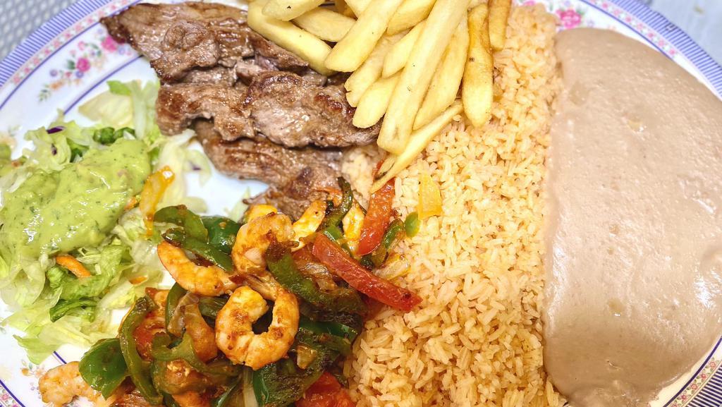Steak  and  Camarones · Rich pieces of seasoned steak with scrumptious grilled shrimp. Served with rice, beans,  French fries, salad and tortillas.