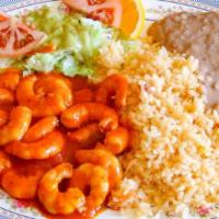 Camarones a la Diabla · Grilled shrimp sautéed in our extra hot, red sauce. Served with rice, beans, salad and warm ...