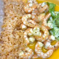 Camarones al Mojo de Ajo · Succulent grilled shrimp in our special garlic sauce. Served with our delicious rice, beans,...