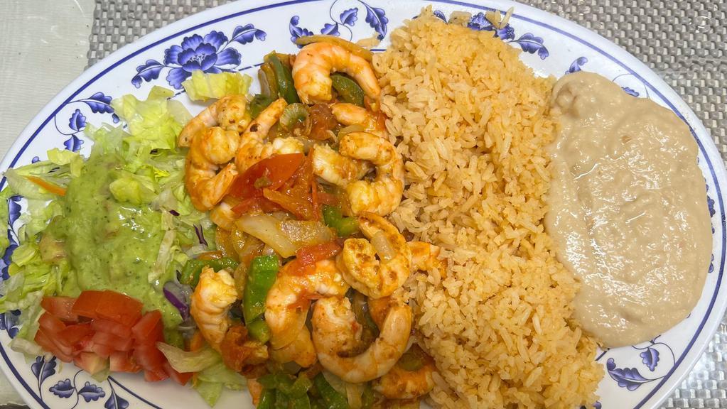 Fajitas De Camarón · Delicious grilled shrimp, seasoned with onions, tomato, bell  pepper. Served with rice, beans, salad and warm tortillas.