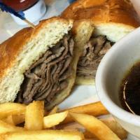 French Dip Au Jus · Four oz roasted usda choice top round deli sliced served on french roll with au jus.