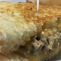 Tuna Melt · Our own tuna salad grilled with melted with cheddar cheese.