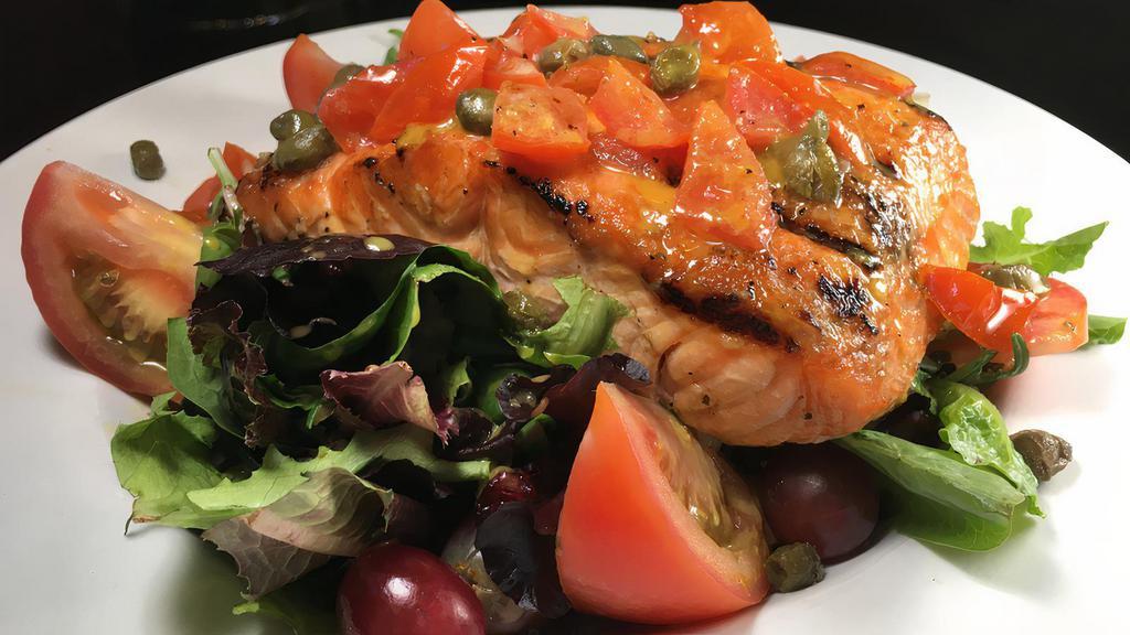 Salmon Salad · Broiled salmon (10 oz) served on a bed of spring mix greens, cucumbers, grapes and cranberries topped with tomatoes, capers and honey mandarin dressing.