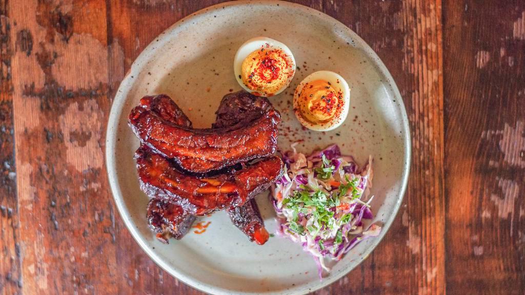 Tamarind Chili Baby Back Ribs · Authentic North Indian dish. Buttermilk coleslaw, curried deviled egg.