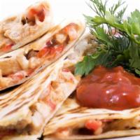 The Spicy Chicken Quesadilla · Spicy! Tender, grilled chicken, and loads of our melty cheese blend folded in a large, soft ...