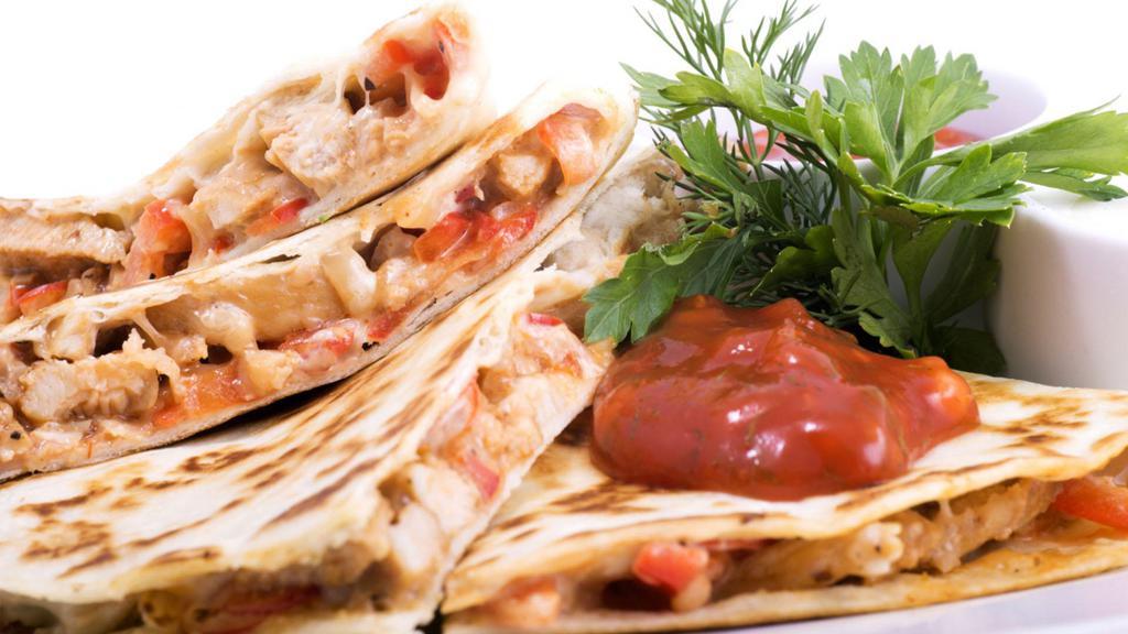 The Spicy Chicken Quesadilla · Spicy! Tender, grilled chicken, and loads of our melty cheese blend folded in a large, soft flour tortilla and grilled until brown and crispy.