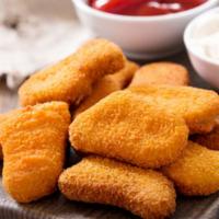 Chicken Nuggets · Golden and crispy on the outside, juicy and tender on the inside chicken nuggets.