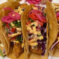 Fish Taco · Beerbatter fried fish topped with pico de gallo, cavage ,chipotle aoili and sour cream