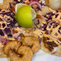 Shrimp Taco · Beerbatter fried Shrimp topped with pico de gallo, cavage ,chipotle aoili and sour cream