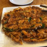 4. Seafood Kimchi Pancake · Korean style pancake with seafood & kimchi. Spicy.