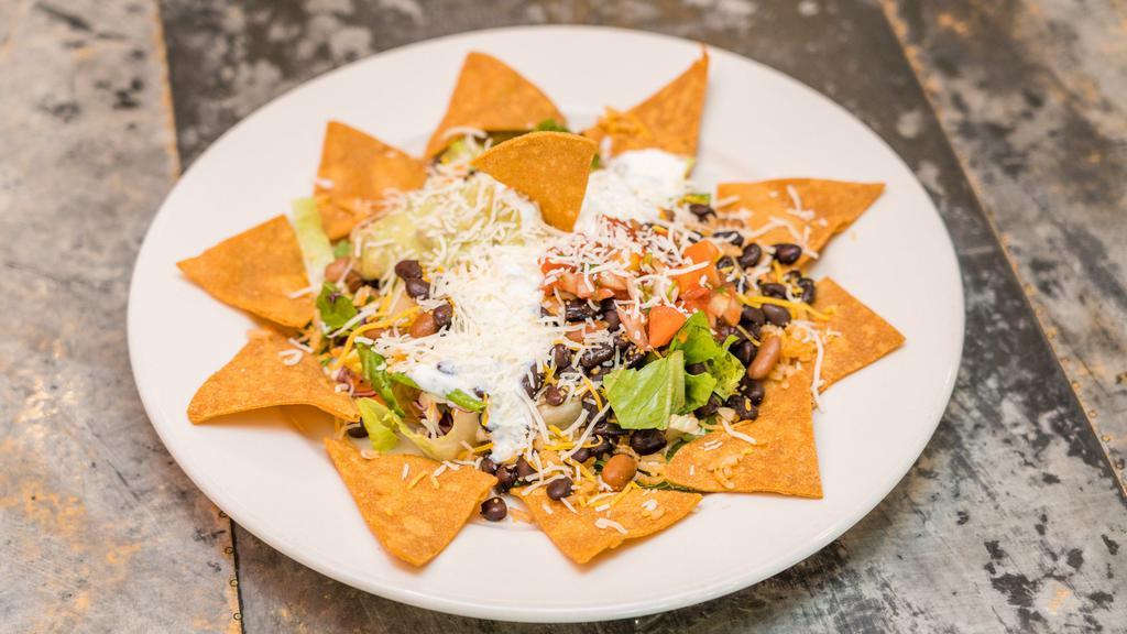 Taco Salad · Rice, beans, lettuce, guacamole, sour cream, pico de gallo, choice of meat white and yellow cheese.