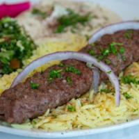 Kifta Kebab Plate · Lean ground beef patty mixed with parsley, onions, and spices. Topped with sesame tahini dre...
