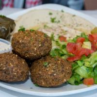 Falafel Plate · Five pieces of falafel with three side dishes. Topped with sesame tahini dressing.