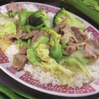 #26. Com Xao Thit Heo · Soy sauce pork over rice