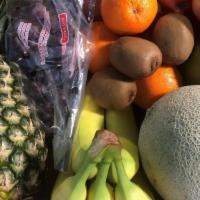 Fruit Box · Fuji apples, kiwis, oranges, grapes, mango, pineapple, cantaloupe, bananas and strawberries....