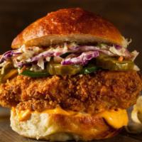 Cajun Sweet & Sour Crispy Chicken Sandwich · Crispy, battered, golden fried chicken patty smothered in classic, pepper jack cheese, our s...