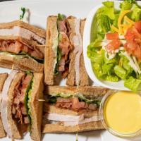 Club Sandwich · Bacon, turkey, lettuce, tomato, mayo on three slices of toasted bread.
