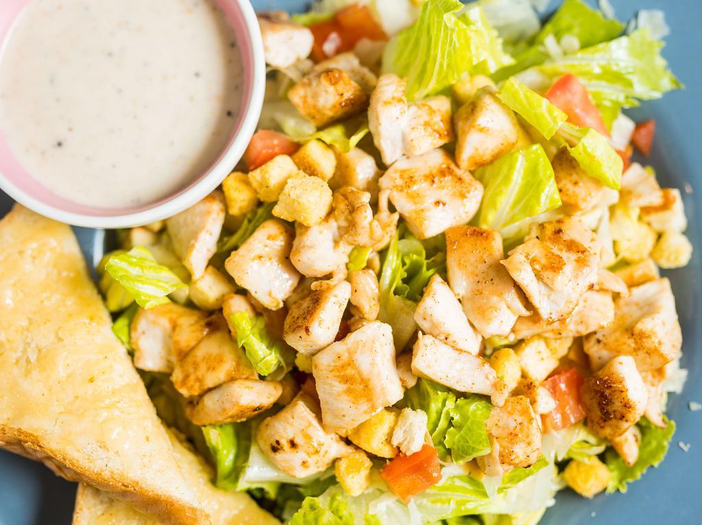 Caesar Salad · Romaine lettuce with diced tomato, shaved parmesan, and croutons.