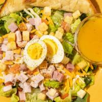 Cobb Salad · Ham, Turkey breast, cheddar, jack, a hard boiled egg and dressing.