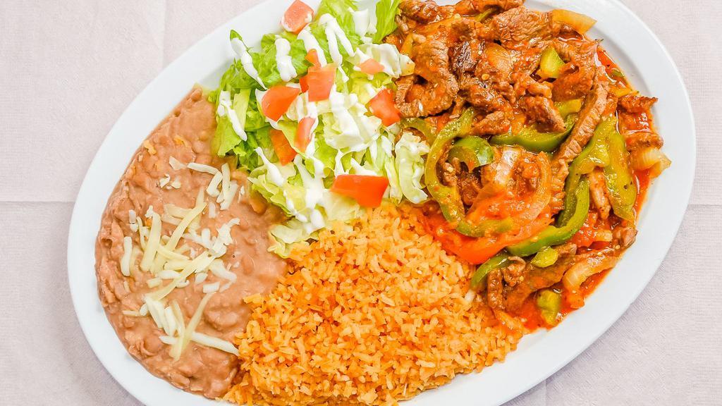Steak Ranchero Plate · Thin marinated steak sautéed in onions, tomatoes, and bell peppers.