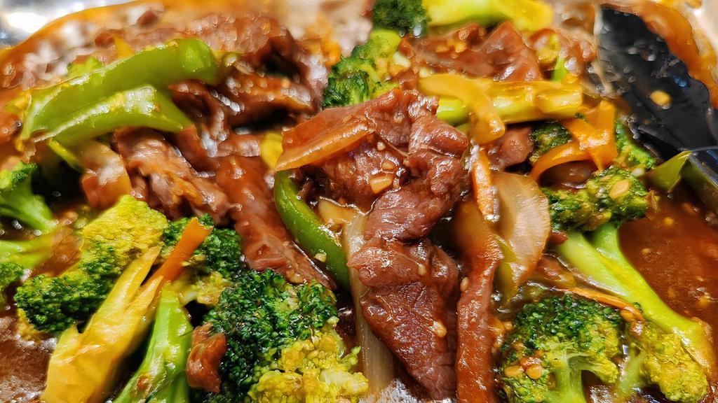 Beef Broccoli · USDA steak cooking with assorted Vegetables in brown sauce.