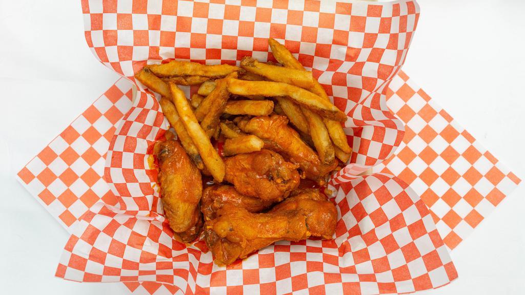3. Buffalo Chicken Wings · Seasoned Right, Golden Fried, and Always Served Fresh. 6 pcs.
And fries