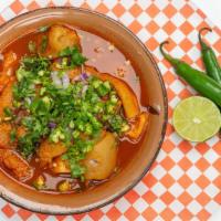 Menudo · A traditional Mexican dish, menudo rojo is a spicy soup made with beef tripe. Served with co...