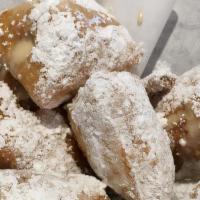 New Orleans Beignets · Classic New Orleans doughnuts made famous by Cafe du Monde, tossed in powdered sugar, with h...