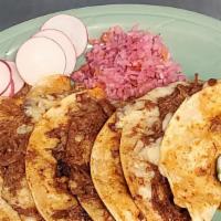 Quesabirrias · Corn tortilla filled with cheese, cilantro, onions, and birria.
