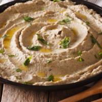 Baba Ghanoush with Pita · Creamy grilled eggplant mixed with sesame sauce, garlic and fresh lemon juice.