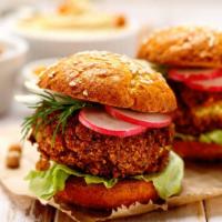 The Falafel Burger · Crispy spicy vegan falafel balls with lettuce, red onion, tomatoes and baba ganoush.