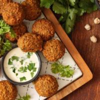 Falafels a La Carte (12) (12 Pc) · Crispy spicy garbanzo beans marinated in homemade spices.