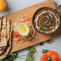 Dal Makhani Sourdough Naan · Vegetarian. Sourdough naan, slow-cooked lentil dal, whipped butter.