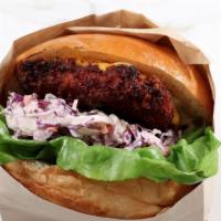 The Wingman Burger · Panko crusted fried chicken, Tillamook cheddar, wasabi slaw, green leaf lettuce lettuce, tom...