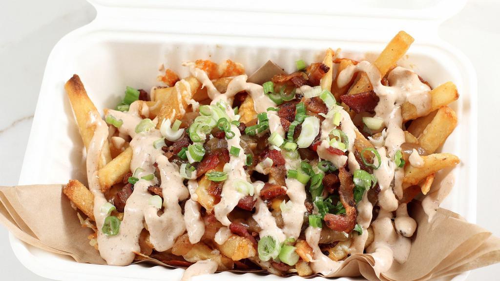 The Dirty Deed Fries · Our signature fries with melted cheddar cheese, grilled onions, chives, butchers cut bacon, and bandit aioli.