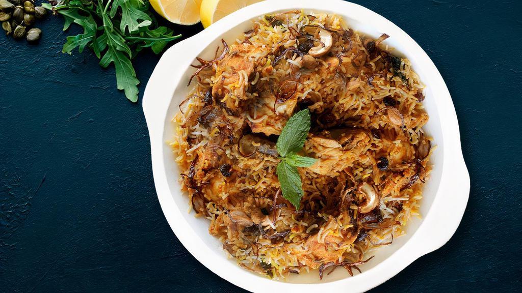 Hyderabadi Chicken Biryani  (HCB) · Long grain basmati rice flavored with saffron is cooked in a traditional hyderabadi style with a delicate blend of exotic spices and herbs, along with pieces of chicken.served with raita and salan.