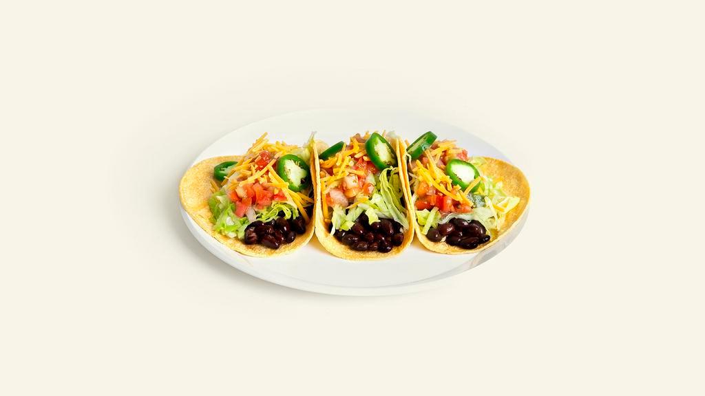 Vegan Tacos · 3 tacos with spiced black beans, jalapenos, pico de gallo, shredded lettuce, and vegan cheese in a corn tortilla.