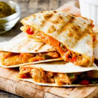 Chicken Quesadilla · Flour tortilla filled with grilled marinated chicken with cheddar and jack cheese. Served wi...