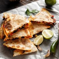 Vegetable Quesadilla · Flour tortilla filled with roasted vegetables with cheddar and jack cheeses. Served with sal...